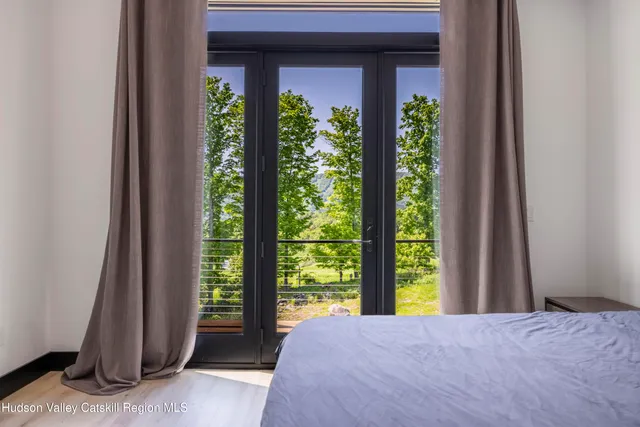 a bathroom with a sink a toilet a mirror and shower