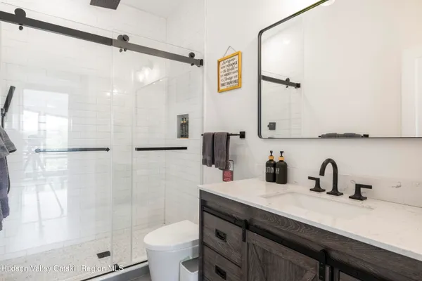 a bedroom with a large bed and a large window