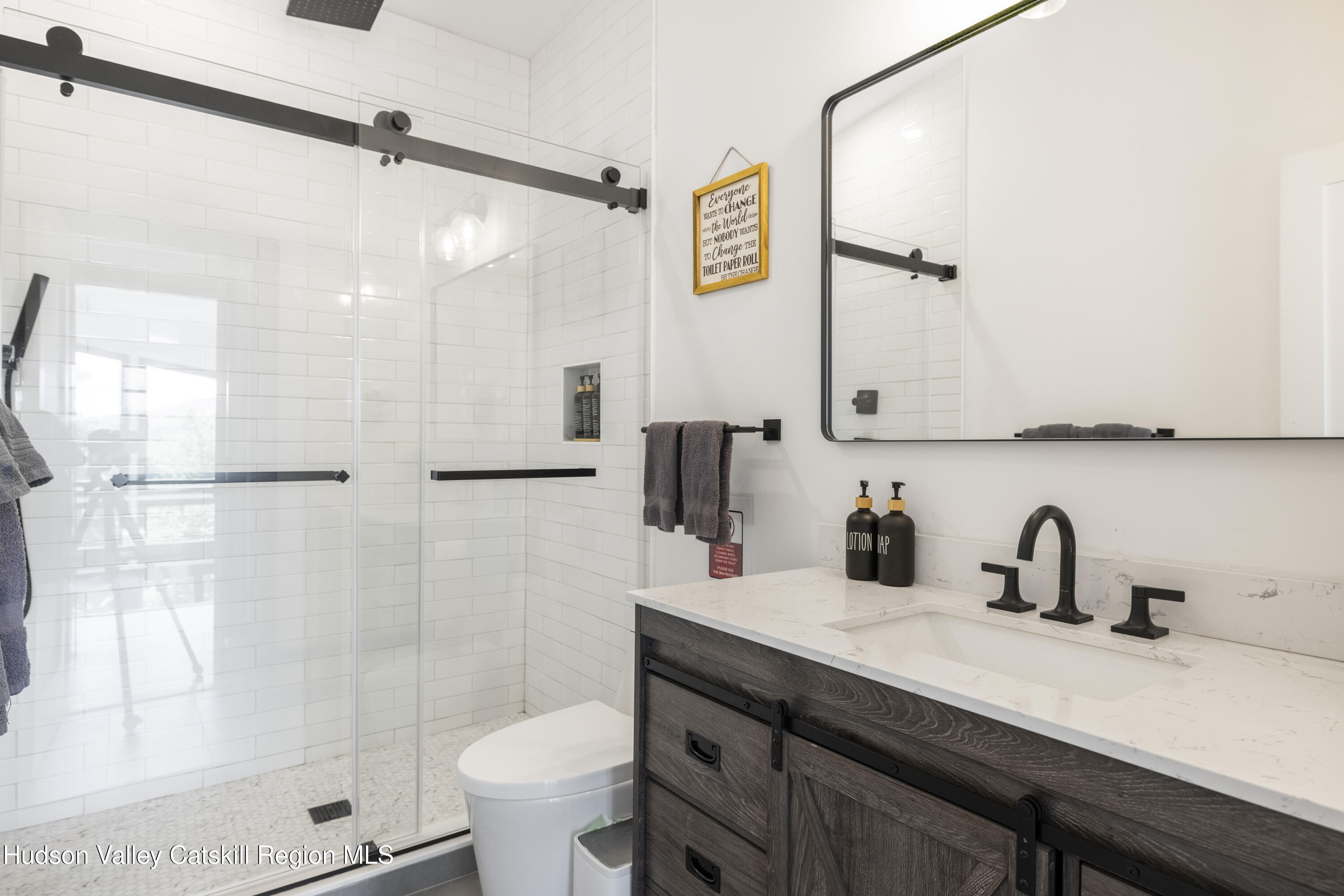 4 Goff Road Windham, NY 12496 - Photo 28 of 68 a bathroom with a sink a toilet a mirror and shower