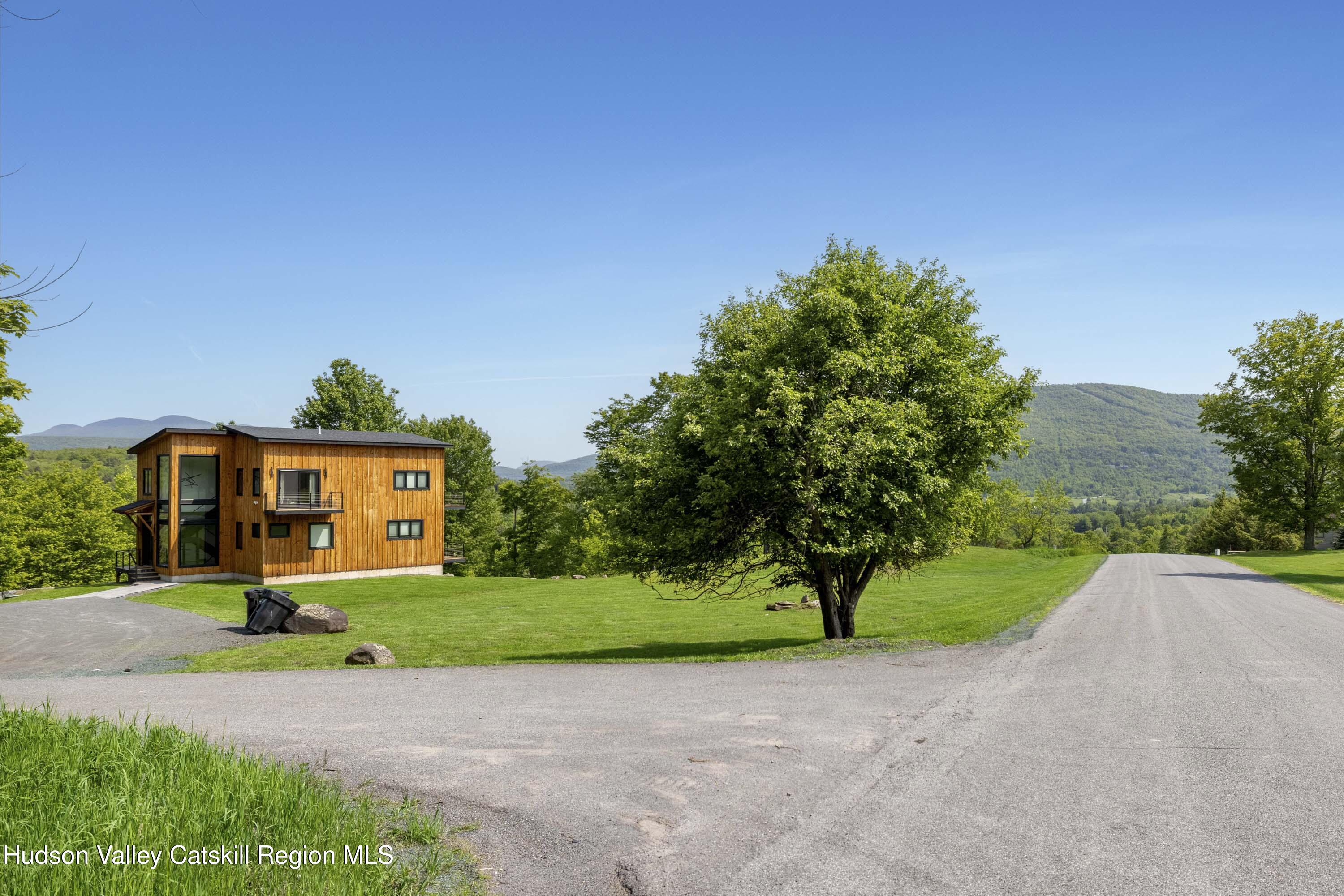4 Goff Road Windham, NY 12496 - Photo 3 of 68 a front view of a house with a yard and garage