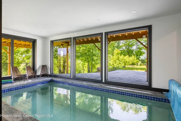 a view of a chairs and table in the patio