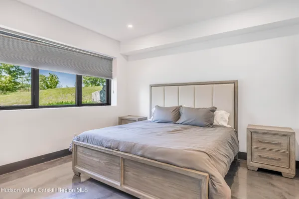 a view of a roof deck with table and chairs with wooden floor and fence