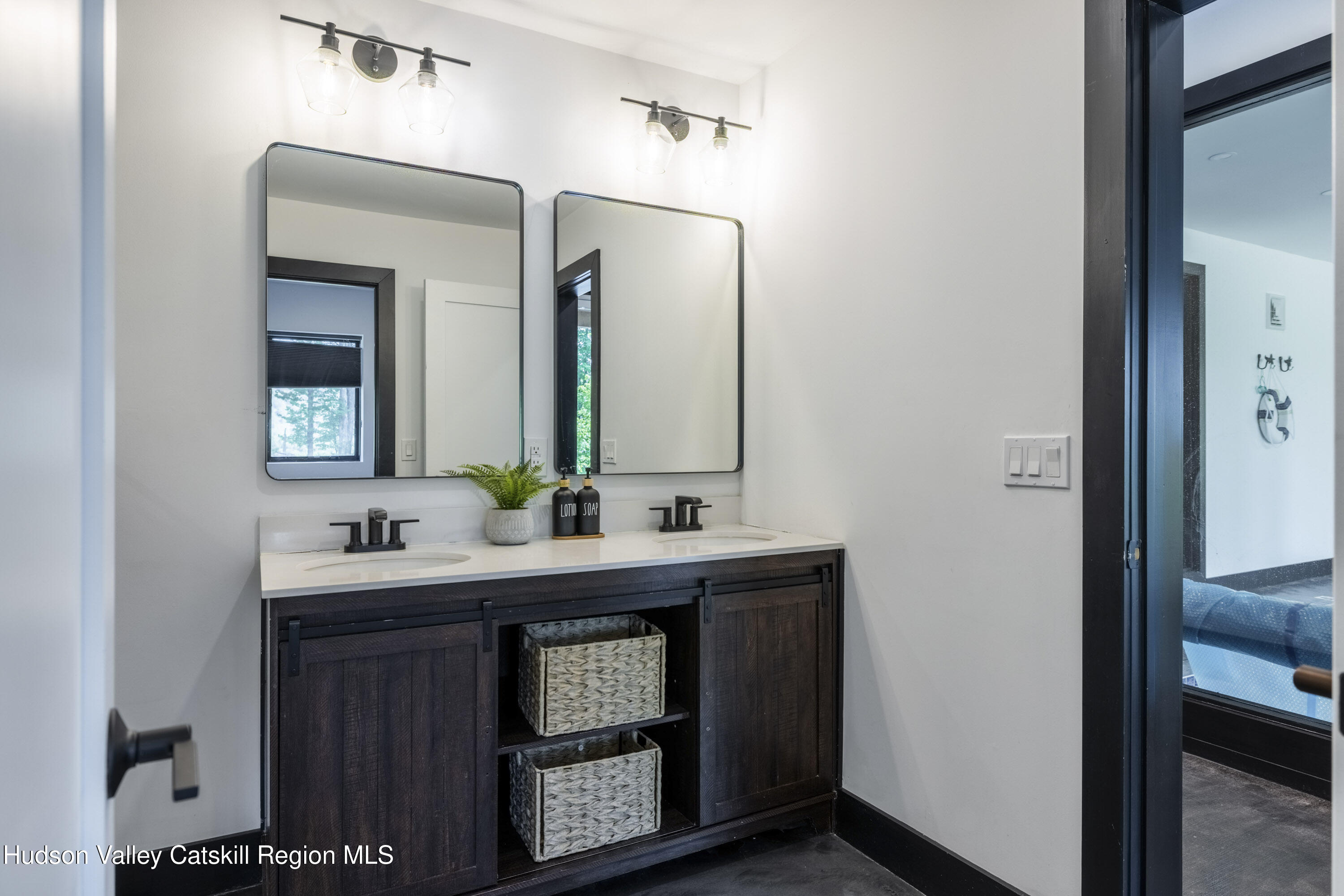 4 Goff Road Windham, NY 12496 - Photo 43 of 68 a bathroom with a double vanity sink and a mirror