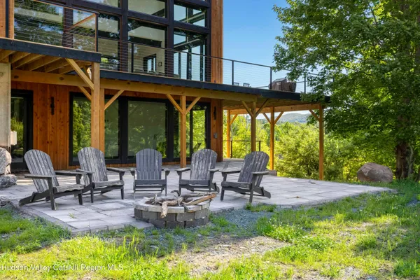 a backyard of a house with outdoor seating