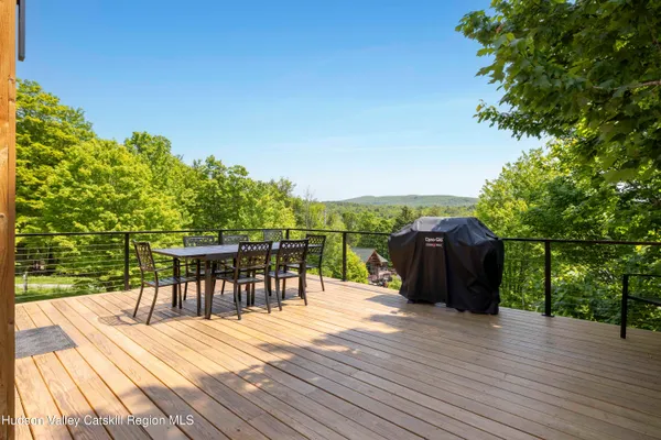 a view of a house with backyard sitting area and garden