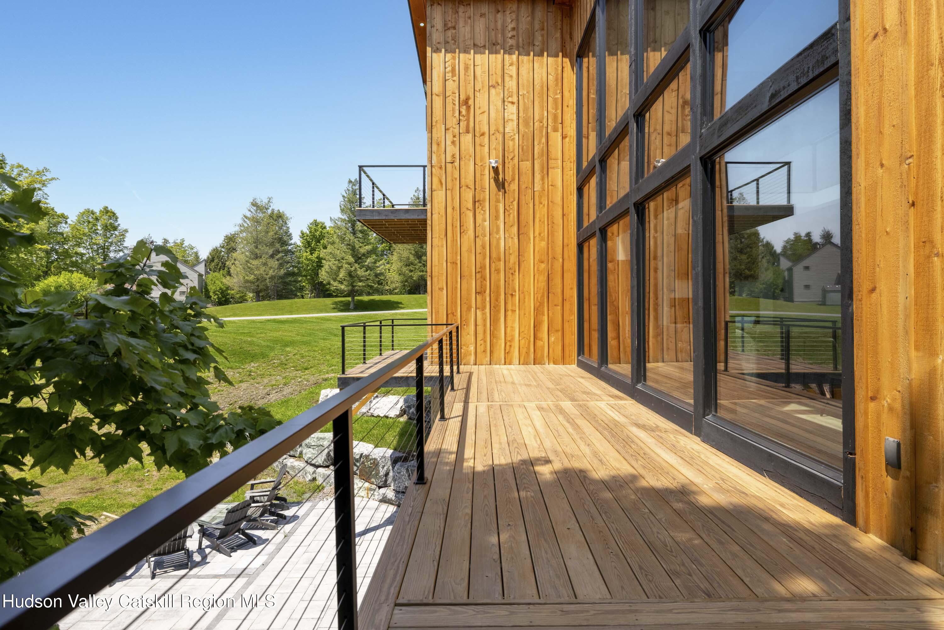 4 Goff Road Windham, NY 12496 - Photo 51 of 68 a view of balcony with floor to ceiling windows and wooden floor