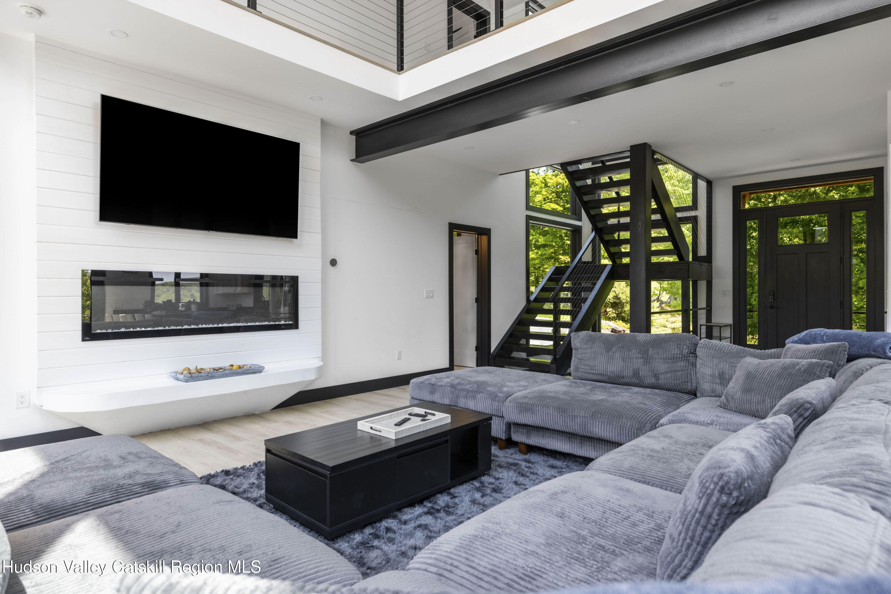 4 Goff Road Windham, NY 12496 - Photo 6 of 68 a living room with furniture and a flat screen tv