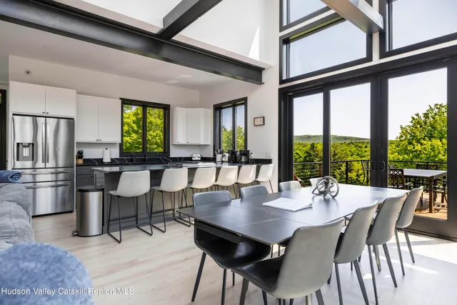 a view of a dining room with furniture window and outside view