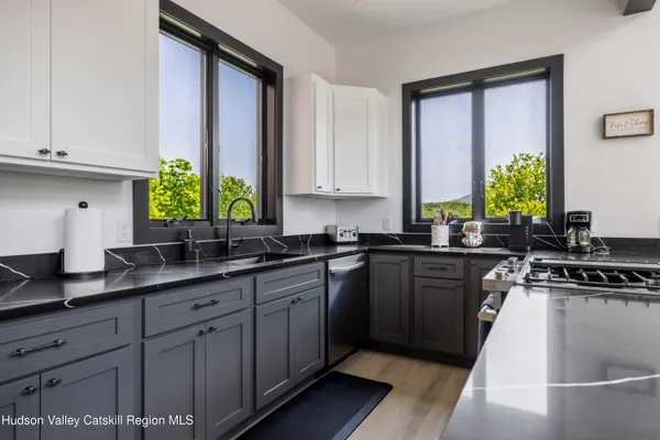 a kitchen with a stove and a sink
