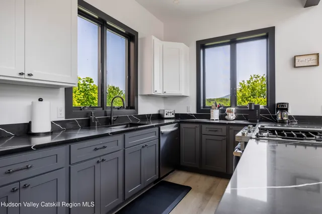 a kitchen with a stove and a sink
