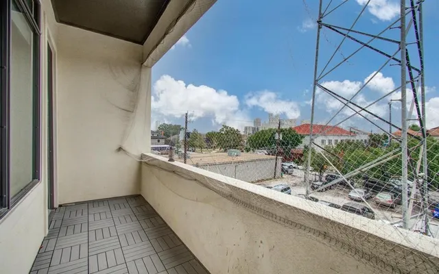a view of a bathroom with a sink and wooden floor