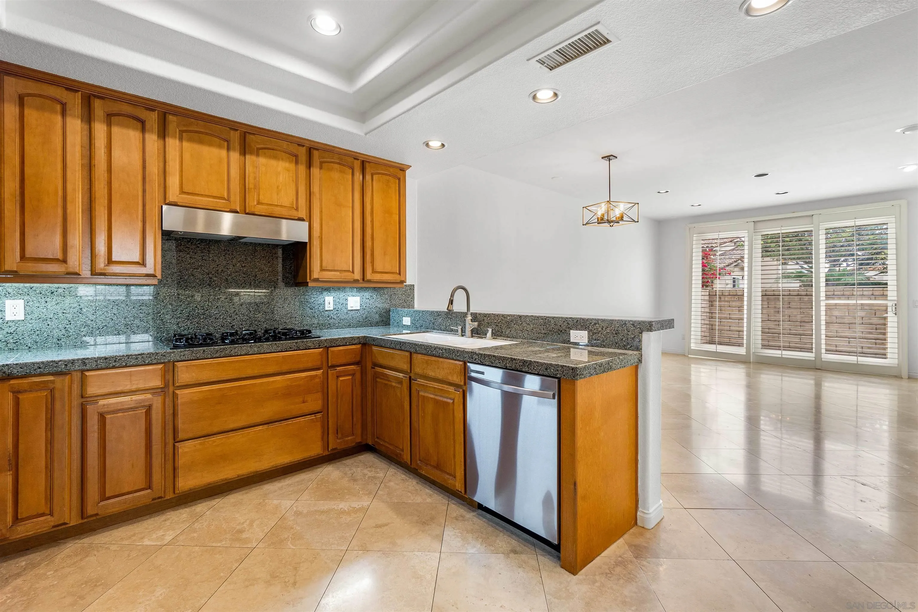 1355 Caminito Balada La Jolla, CA 92037 - Photo 15 of 31 a kitchen with stainless steel appliances granite countertop a sink and a stove
