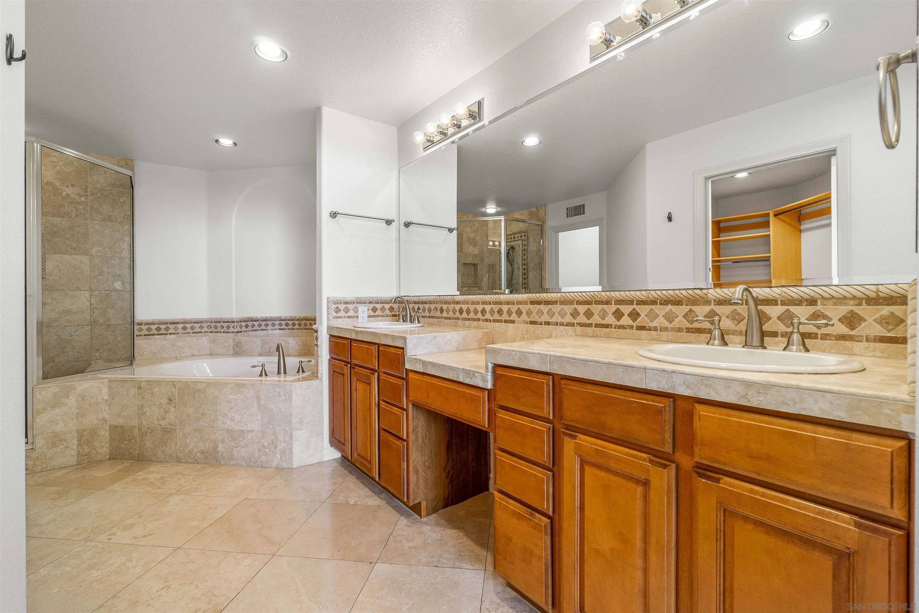 1355 Caminito Balada La Jolla, CA 92037 - Photo 20 of 31 a spacious bathroom with a granite countertop sink a mirror and a