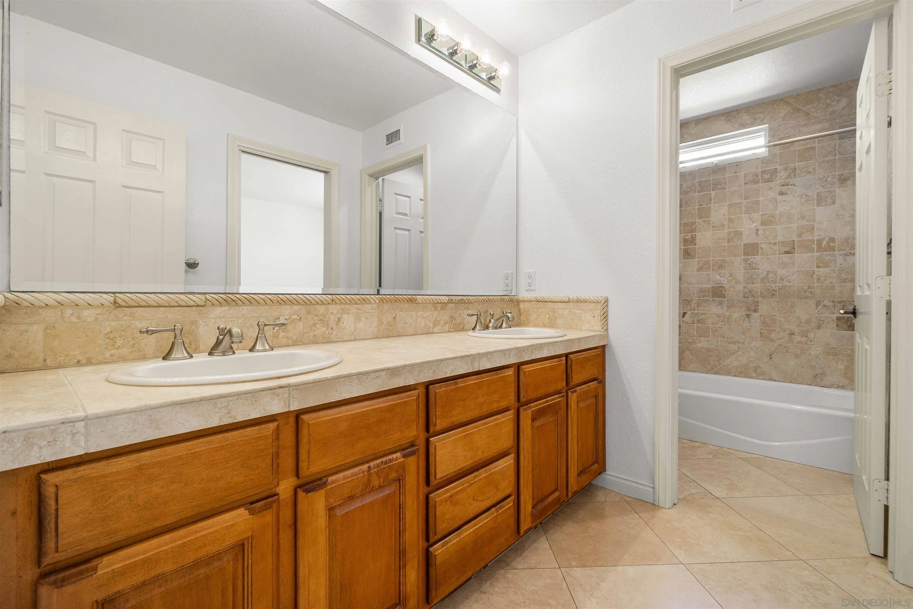 1355 Caminito Balada La Jolla, CA 92037 - Photo 24 of 31 a bathroom with a granite countertop sink mirror and