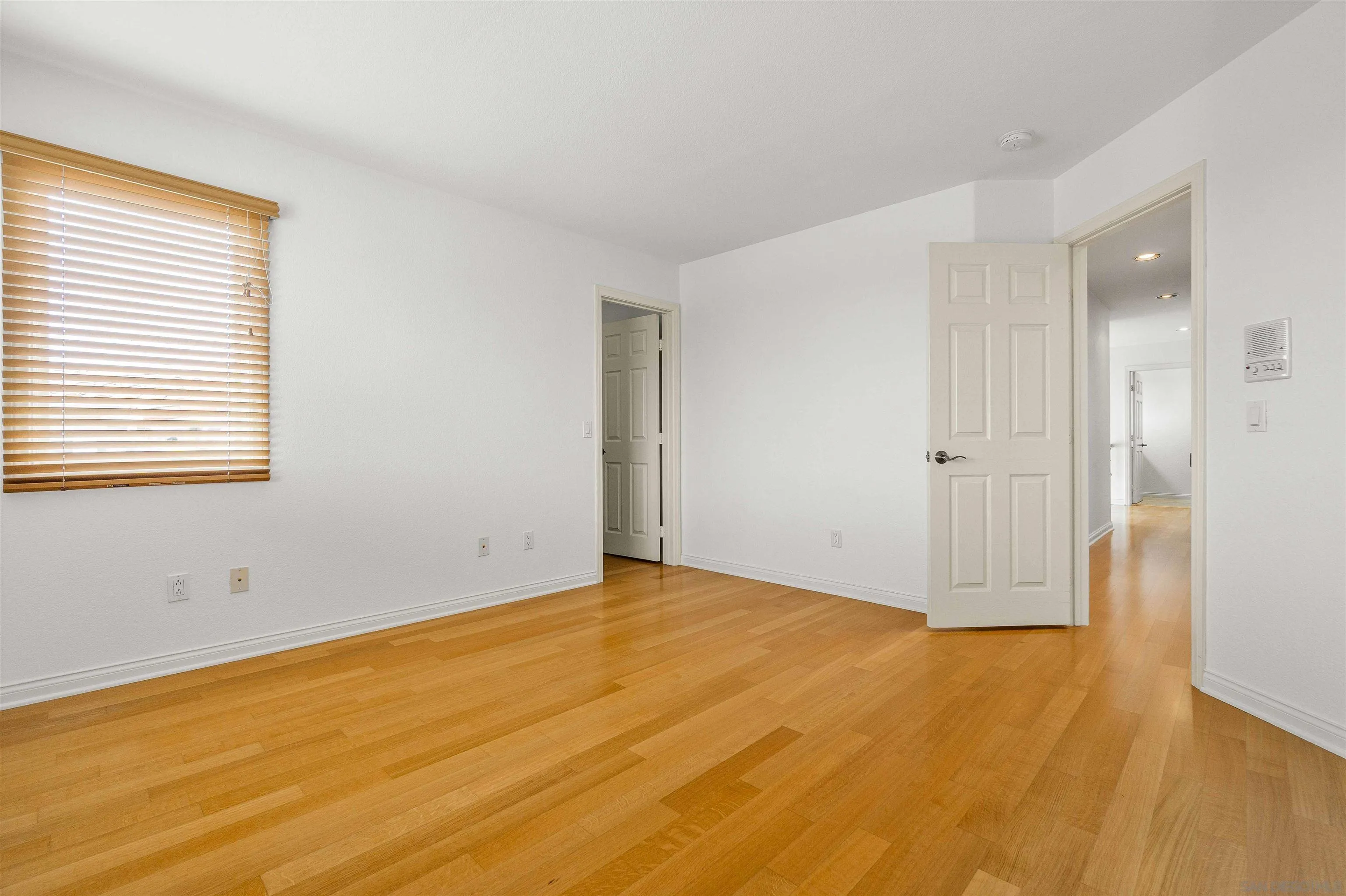 1355 Caminito Balada La Jolla, CA 92037 - Photo 25 of 31 a view of an empty room with wooden floor and a window