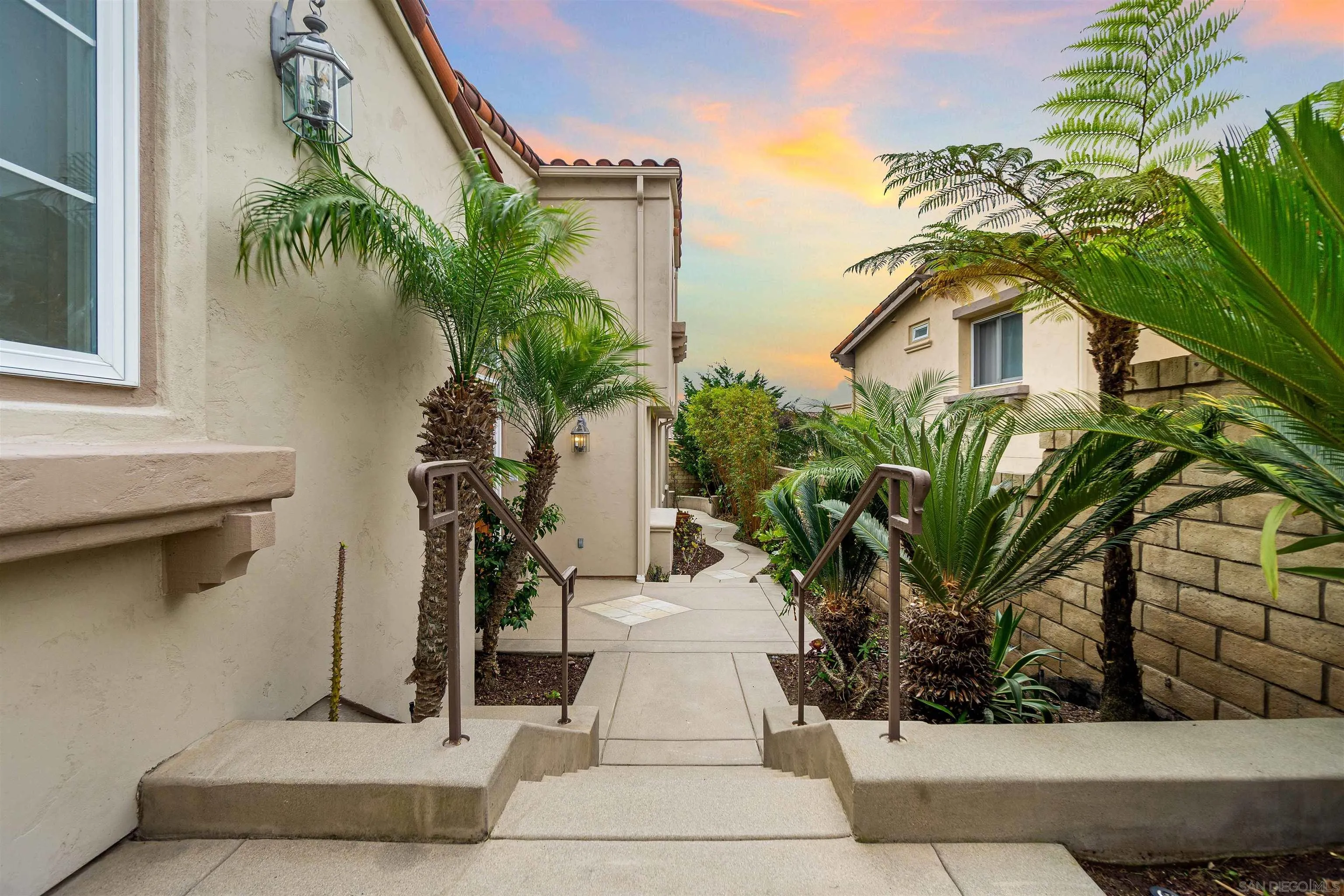 1355 Caminito Balada La Jolla, CA 92037 - Photo 3 of 31 a front view of a house with a yard