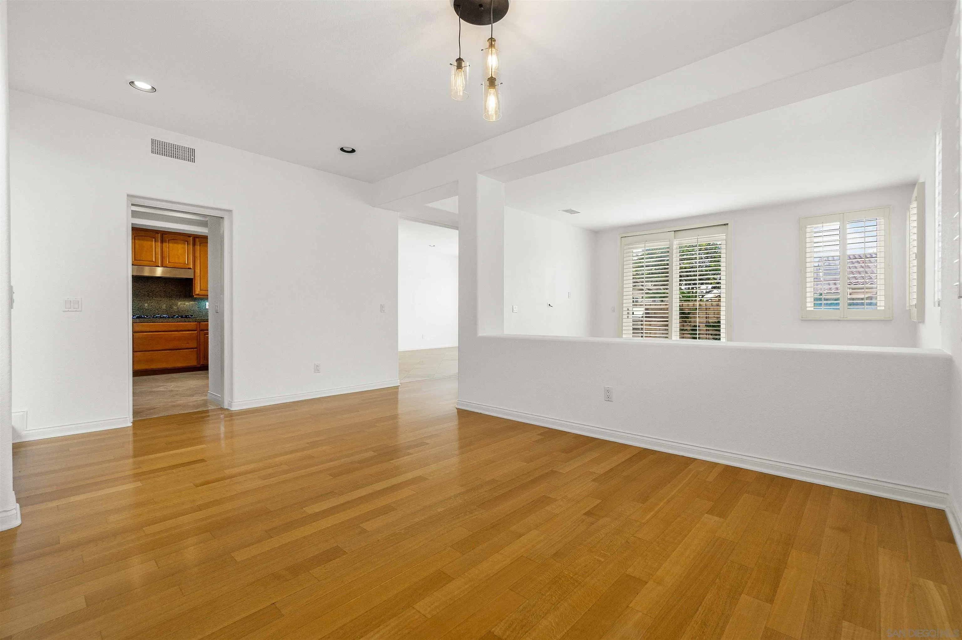 1355 Caminito Balada La Jolla, CA 92037 - Photo 8 of 31 a view of an empty room with a window and wooden floor