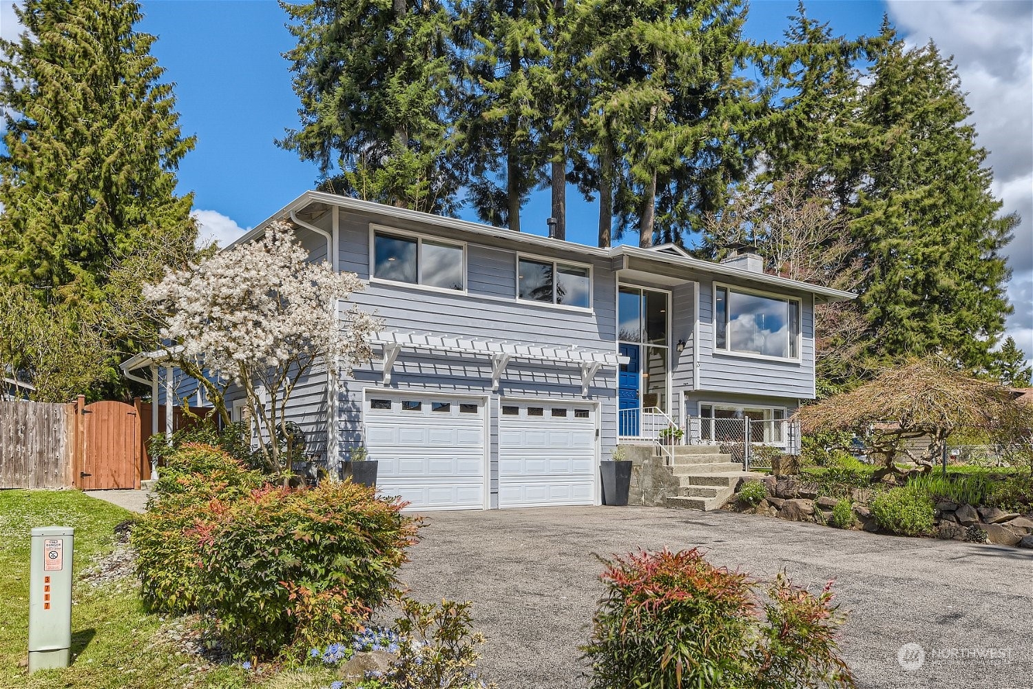 3 218th Place Southwest Bothell, WA 98021 - Photo 1 of 27 a front view of a house with a garden