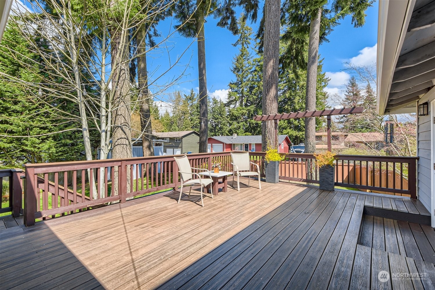 3 218th Place Southwest Bothell, WA 98021 - Photo 27 of 27 a view of a roof deck with table and chairs wooden floor and fence