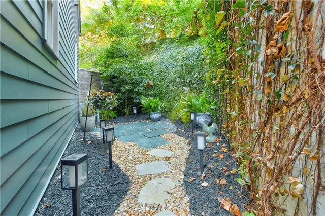 a backyard of a house with outdoor seating
