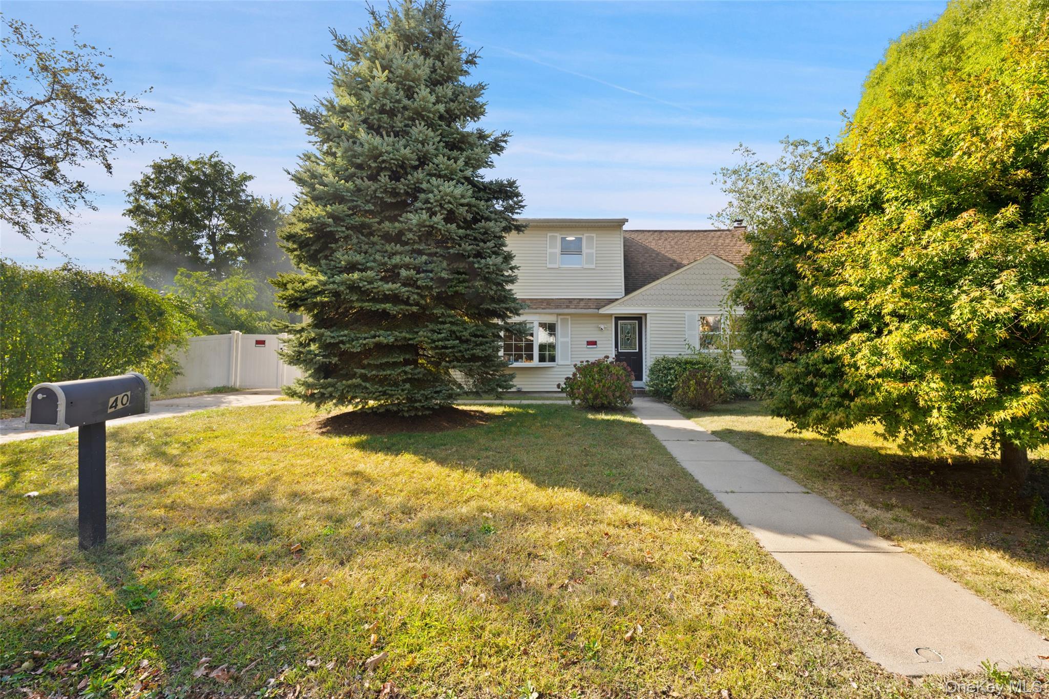 View of front of property featuring roof with shingles