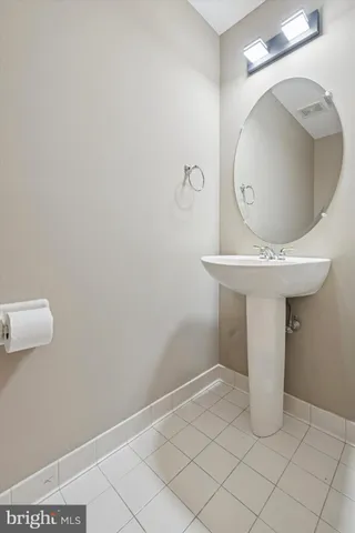 a bathroom with a sink and mirror