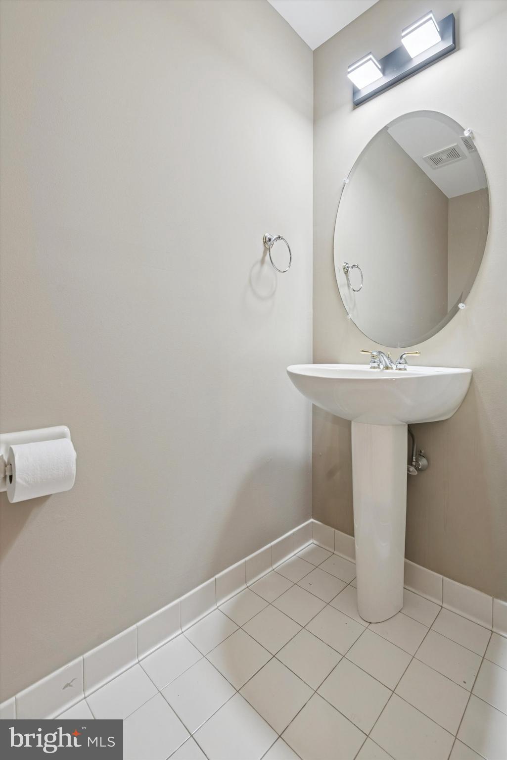 79 Granite Lane, Unit 2 Chester Springs, PA 19425 - Photo 14 of 15 a bathroom with a sink and mirror