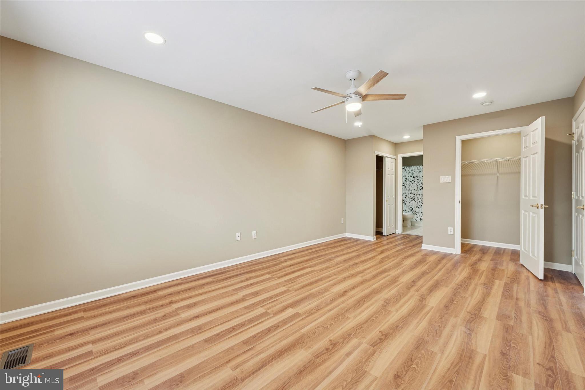 79 Granite Lane, Unit 2 Chester Springs, PA 19425 - Photo 4 of 15 wooden floor in an empty room with a window