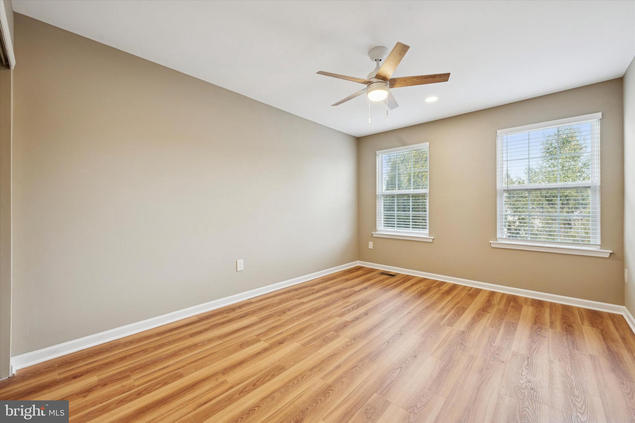 79 Granite Lane, Unit 2 Chester Springs, PA 19425 - Photo 5 of 15 a view of an empty room with wooden floor and a window