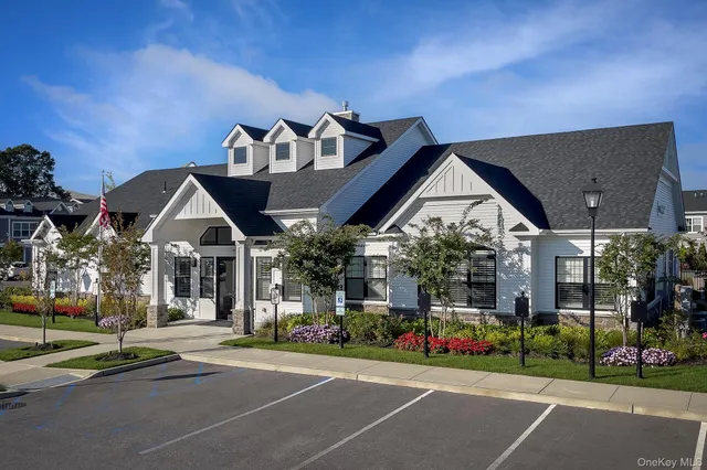 a view of a house with a yard and plants