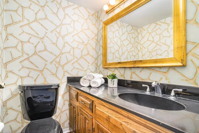 a kitchen with stainless steel appliances a sink a stove and a window