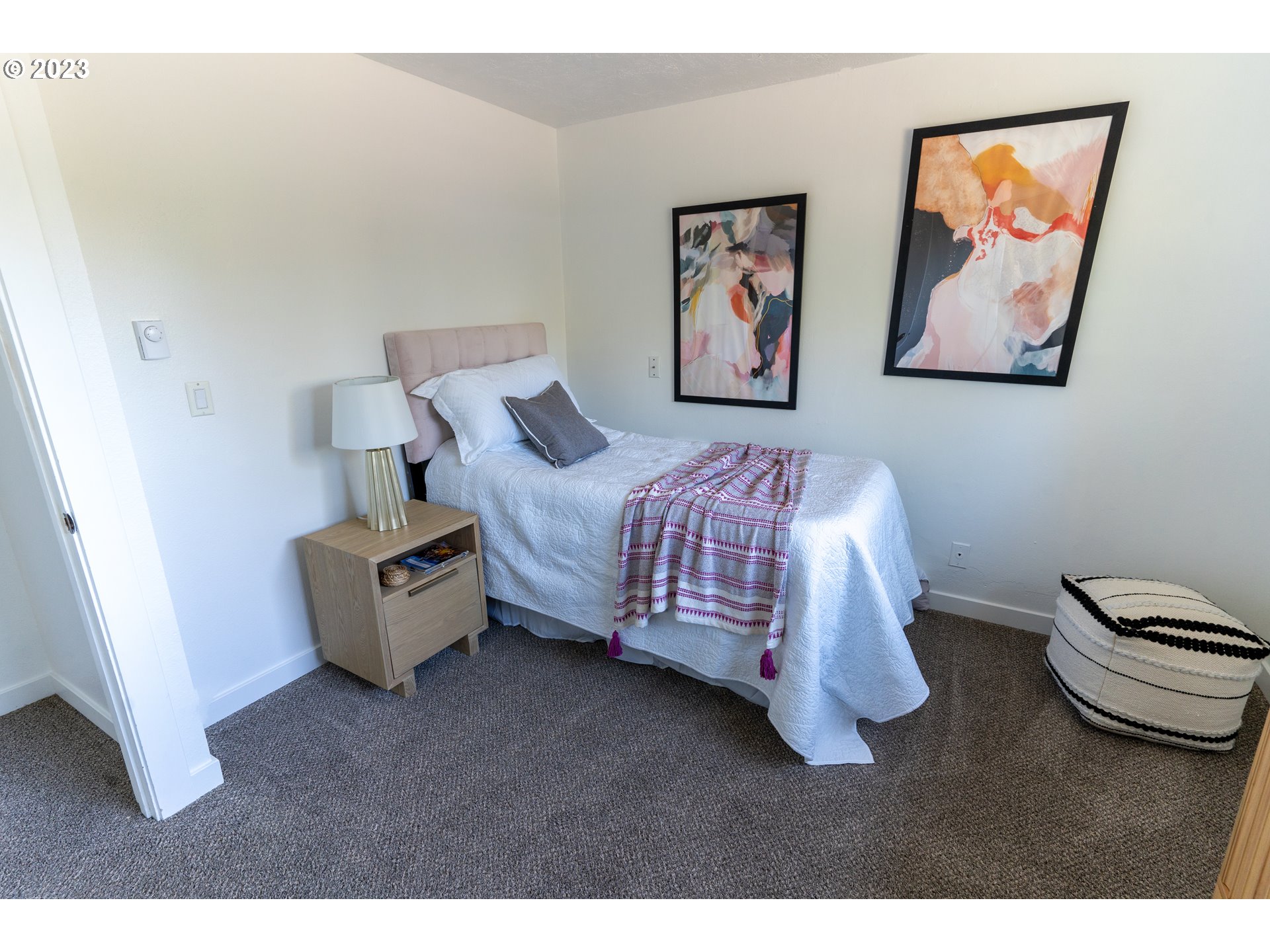 18760 Cook Street Oregon City, OR 97045 - Photo 17 of 36 a bed room with a bed and a wall painting