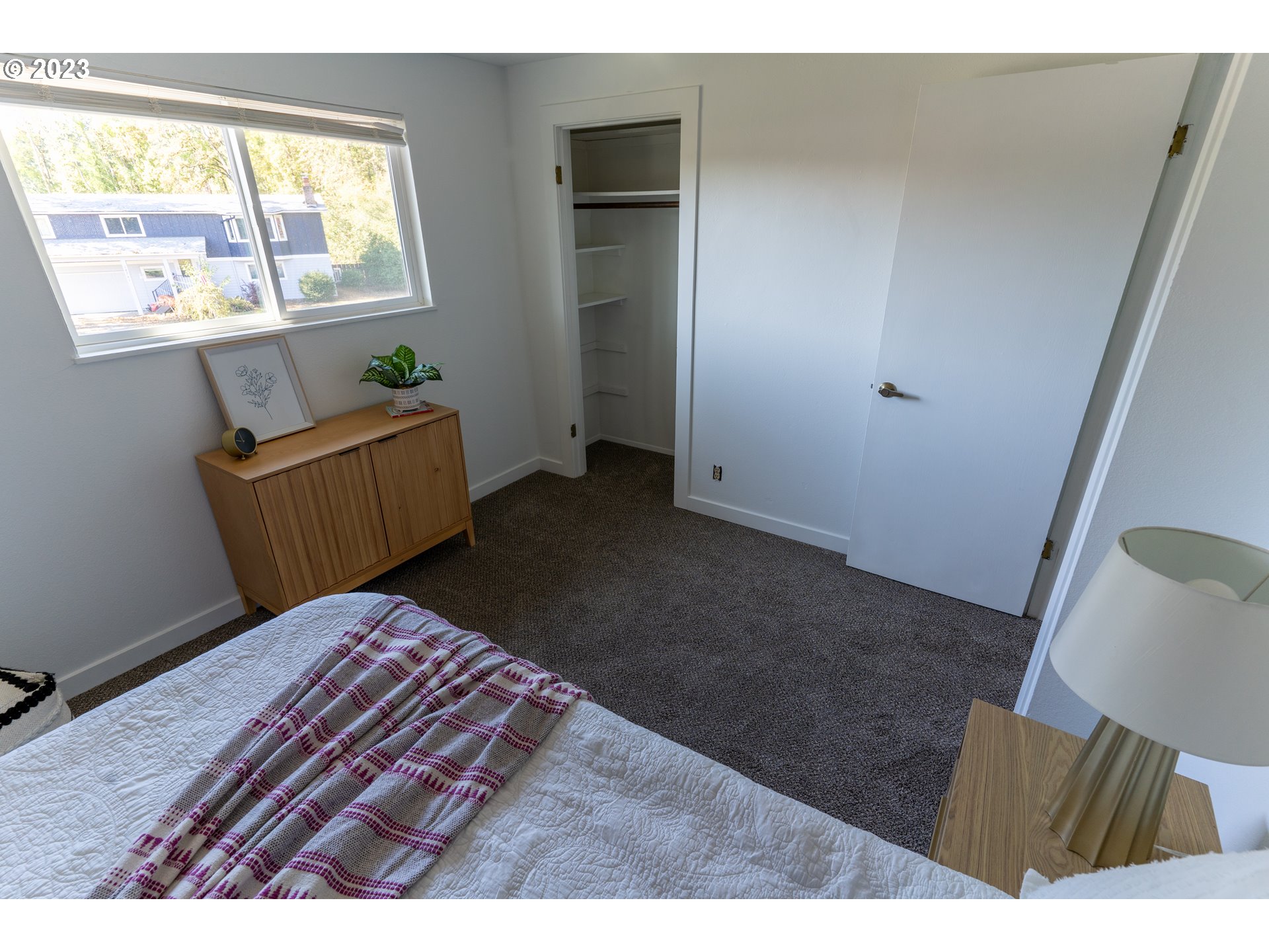18760 Cook Street Oregon City, OR 97045 - Photo 18 of 36 a bedroom with a bed and a window
