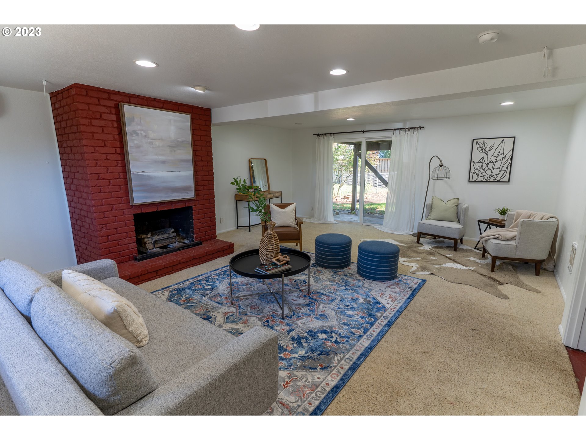 18760 Cook Street Oregon City, OR 97045 - Photo 28 of 36 a living room with furniture a window and a fireplace