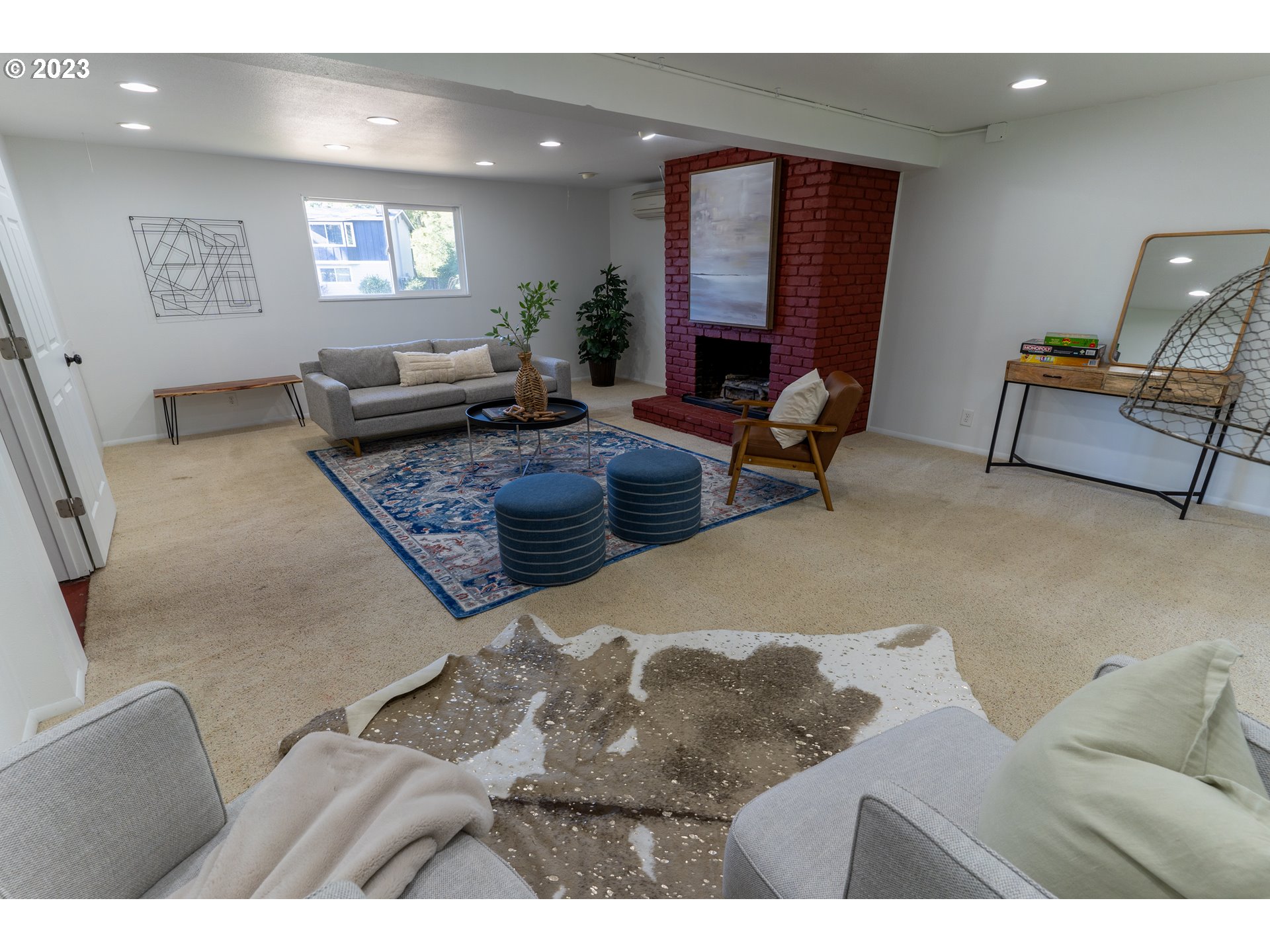 18760 Cook Street Oregon City, OR 97045 - Photo 30 of 36 a living room with furniture and a flat screen tv