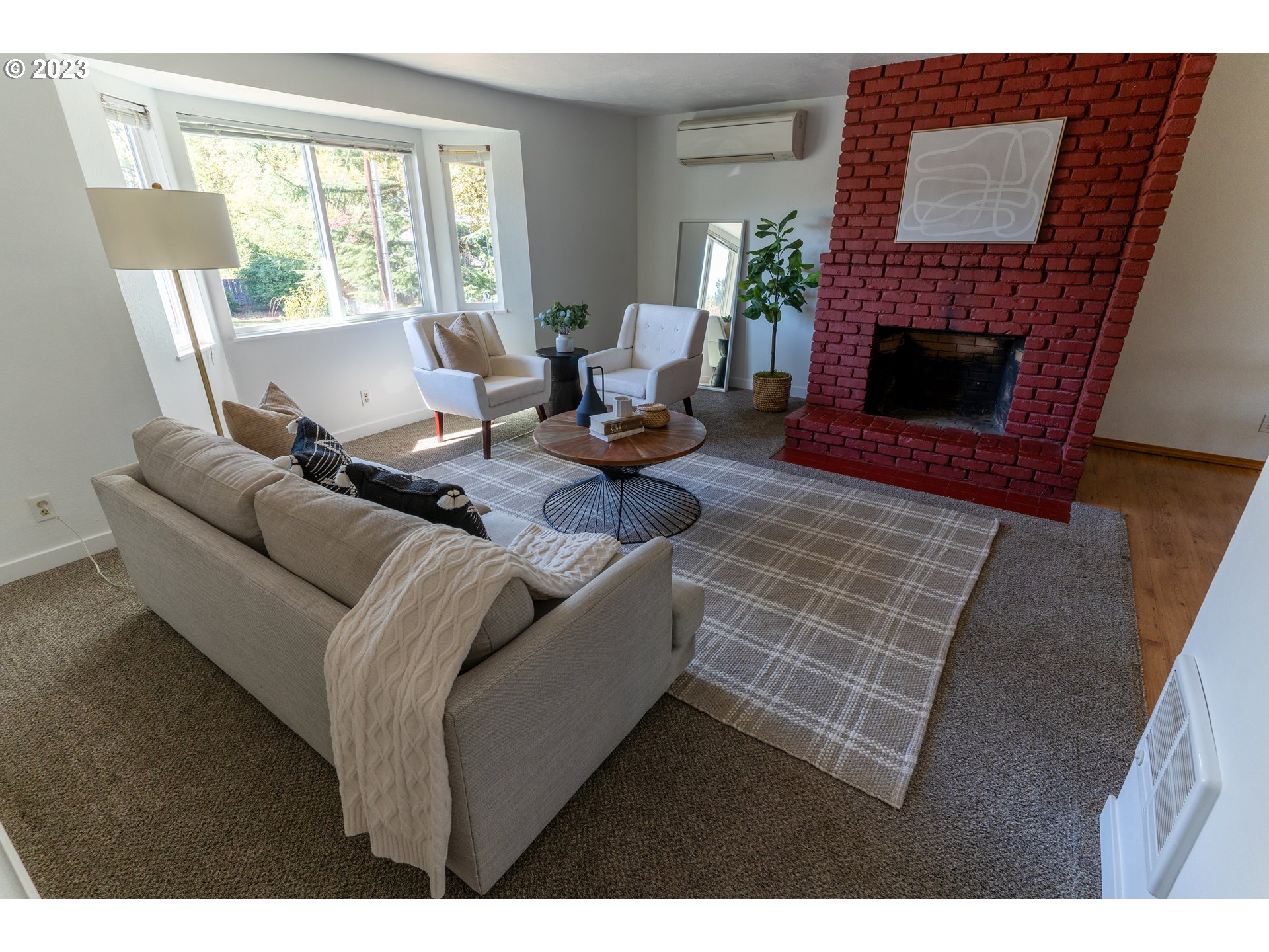 18760 Cook Street Oregon City, OR 97045 - Photo 6 of 36 a living room with furniture fireplace and a large window