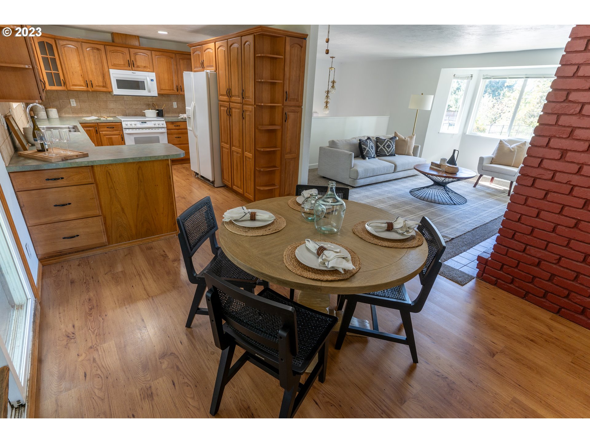 18760 Cook Street Oregon City, OR 97045 - Photo 9 of 36 a view of a dining room with furniture and wooden floor
