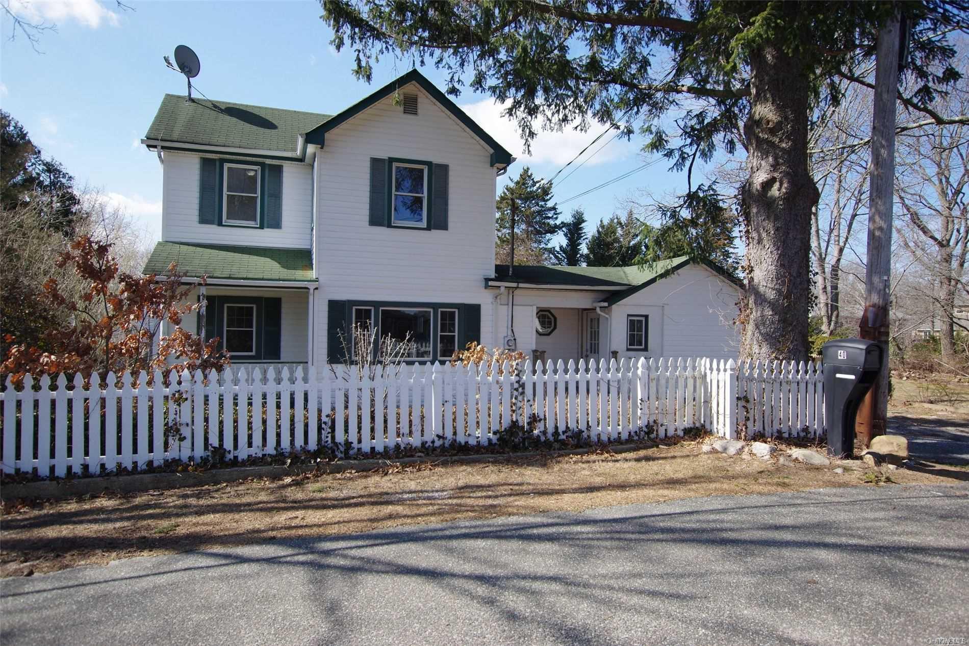 40 Amber Road Rocky Point, NY 11778 - Photo 1 of 1 a front view of a house with a garden