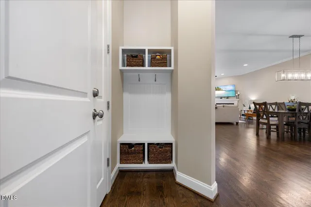 a kitchen with granite countertop white cabinets and stainless steel appliances