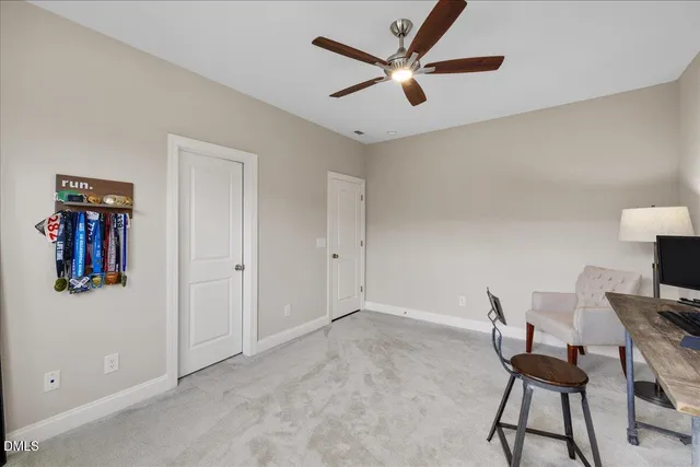 a work room with furniture and windows