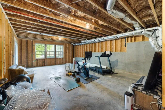 a view of entryway with wooden floor and stairs