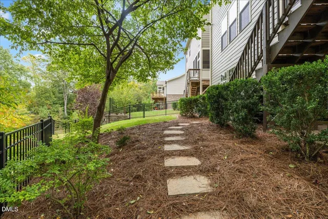a view of a porch with furniture and a yard