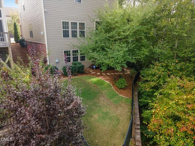 an aerial view of residential houses with yard and swimming pool