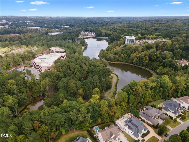 a backyard of a house with a garden and plants