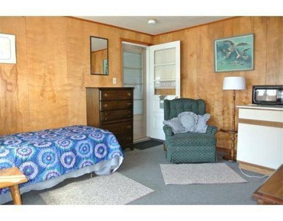 352 Main Street, Unit 10 Clinton, MA 01510 - Photo 5 of 6 a bedroom with furniture and a couch