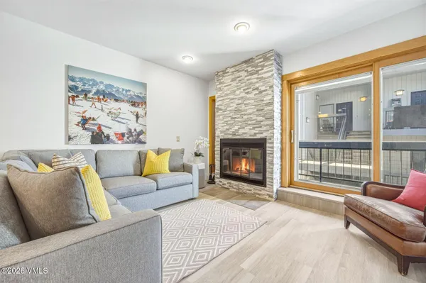 a living room with furniture and a fireplace