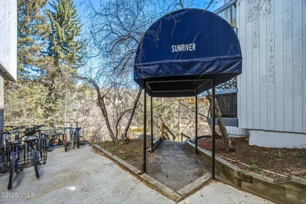 a view of a chairs and table in the patio