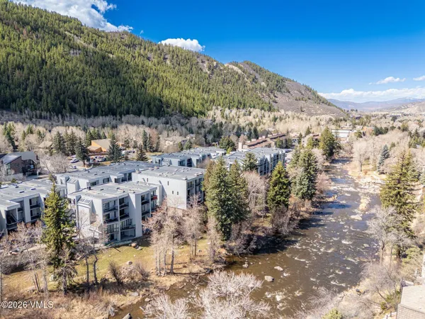 a view of a town with mountains in the background