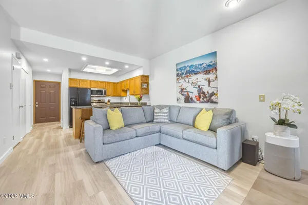 a living room with furniture and a large window
