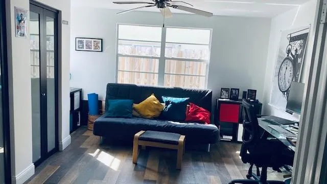 a living room with furniture and a window